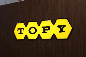 Topy Industries signage and logo